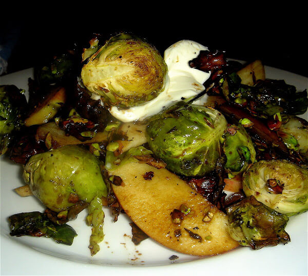 Charred Brussels sprouts, sweet apples, sour crème fraîche and toasted pistachios combine to form a delicious mixture of contrasting flavors and textures in this "Alta" tapas recreation. A balsamic vinegar reduction offers an at once sweet and sharp bite. // alexandracooks.com