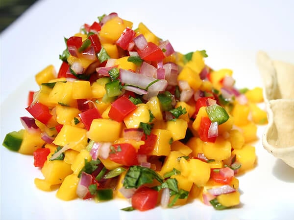 Flavored with traditional salsa seasonings — lime juice, cilantro and jalapeños — this mango pico de gallo makes a refreshing appetizer. Serve with pappadums for a nice change from tortilla chips. // alexandracooks.com