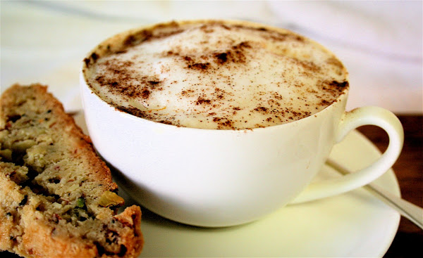 A cup of homemade chai aside homemade biscotti.