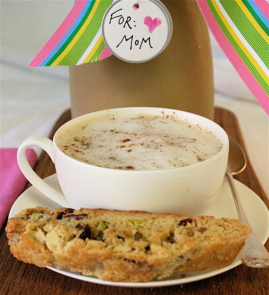 A cup of homemade chai with a homemade biscotti.