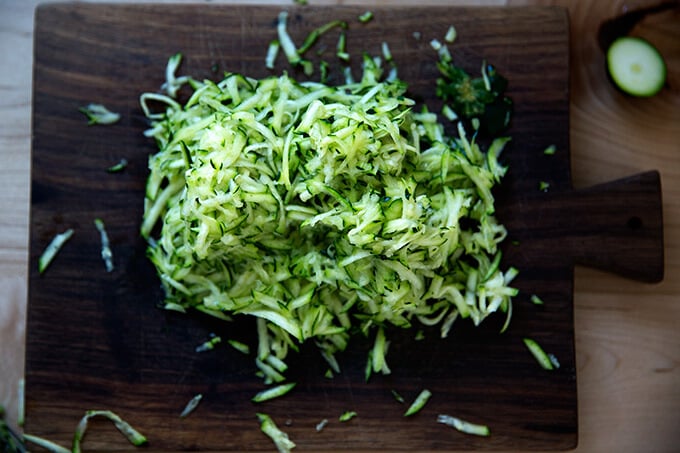 Grated zucchini on a board.