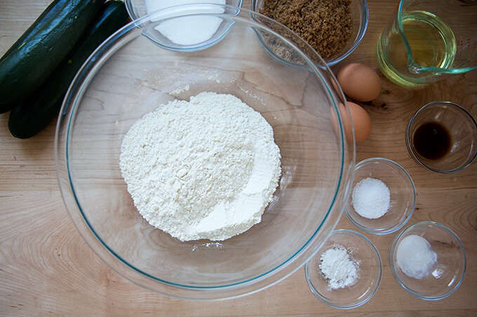 Ingredients to make zucchini bread on a countertop.