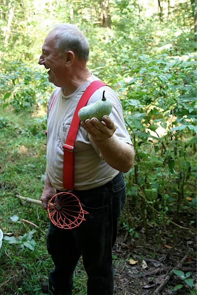 Sam Consylman holding a pawpaw.