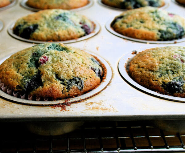 These berry muffins are moist, sweet, and a yummy yummy treat! I used all frozen berries and they came out beautifully. // alexandracooks.com