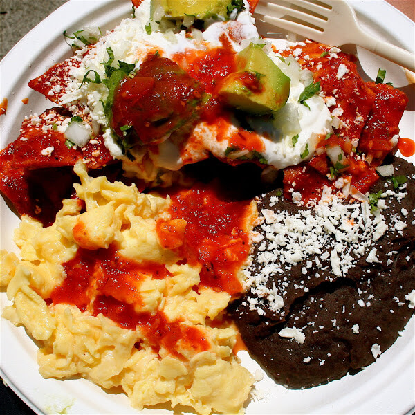 Two years ago, while visiting San Francisco for a wedding, Ben and I discovered the Primavera Mexican stand at the Saturday Ferry Building farmers' market. I have not stopped dreaming about the guajillo-chile chilaquiles since. // alexandracooks.com
