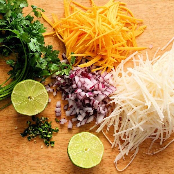 Frozen halibut steaks fried up beautifully for these fish tacos, and once wrapped in the tortilla, spread with a dab of sriracha-sour cream and topped with this tasty slaw, the fish becomes a second-string player. // alexandracooks.com