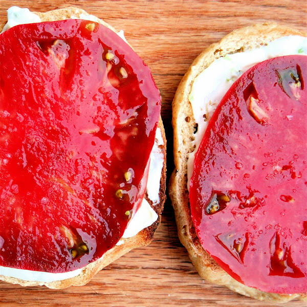 This has been my breakfast now for three days in a row: A toasted sesame bagel spread with chive cream cheese topped with a slice of tomato and sprinkled, of course, with sea salt. Amazing. // alexandracooks.com