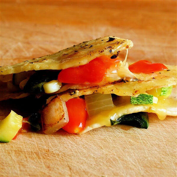 The vegetable sauté for these quesadillas will taste delectable in any tortilla. Just use whatever variety of flour or corn tortillas you prefer. In fact, while I am thrilled with the results of the fresh corn masa tortilla, this recipe is all about the filling. I am loving the taste of corn with basil right now. // alexandracooks.com