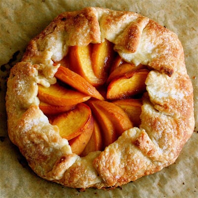 I love love love this peach tart recipe, especially the douch. I'm not quite sure how it differs from a traditional pie dough but it without fail produces a perfect crust. It also complements morning coffee very nicely as well. You won't be disappointed. // alexandracooks.com