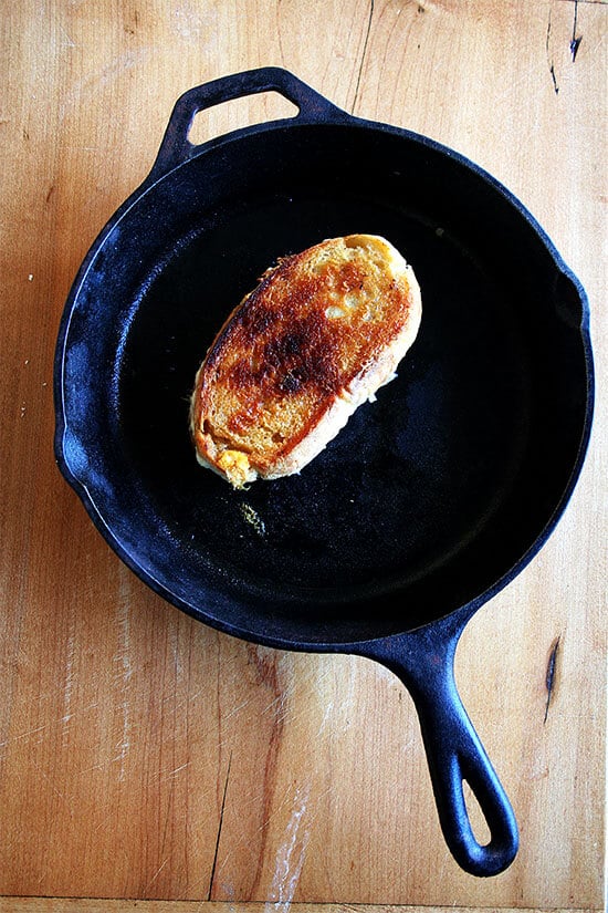 Saveur's recipe for "the ultimate grilled cheese sandwich" calls for placing a cast-iron skillet over low heat and cooking the sandwich, flipping once, for 20 minutes. Who knew it took so long to make a grilled cheese sandwich? I did in fact cook my grilled cheese for 20 minutes and, thanks to a hefty slathering of butter, my sandwich crisped up nicely in my cast-iron pan. // alexandracooks.com