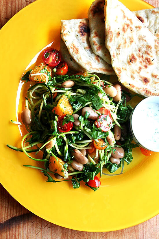 I have been wanting to incorporate more beans — such a healthy, affordable food, filled with protein — into my diet, and this salad has proven to be a great way to do so. I made this salad two nights in a row last week with my Alubia Criollo beans and other goodies from my CSA — arugula, cherry tomatoes, chives, shaved zucchini and chopped orange. // alexandracooks.com