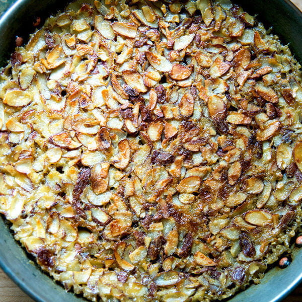 A bowl of freshly baked steel cut oatmeal with almonds.