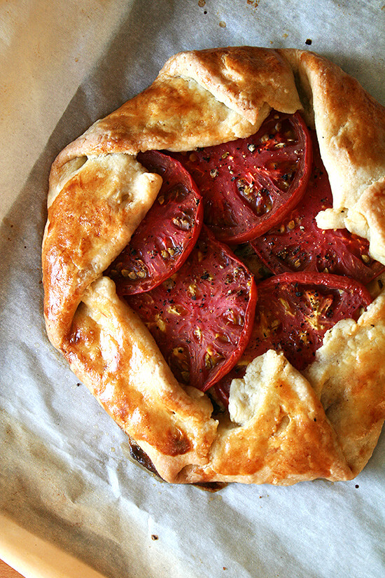 Freshly baked savory galette with corn, tomatoes, and Gruyère. 