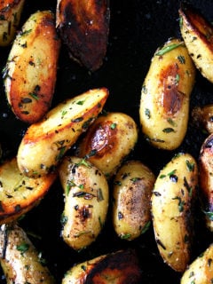 These fingerling potatoes are cooked perfectly, not the slightest bit overdone. And moreover, they are seasoned perfectly, too, not a bit too salty and subtly infused with the flavors of rosemary, thyme and garlic. It's such a treat. I think you'll like them, too. // alexandracooks.com