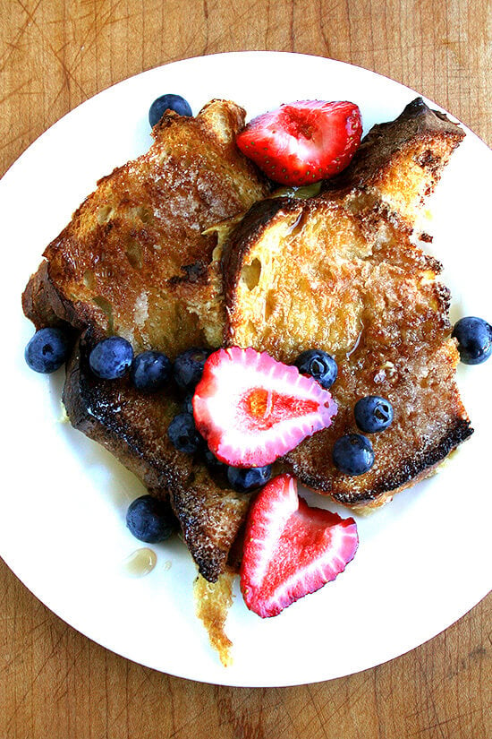 A plate of overnight French toast topped with berries.
