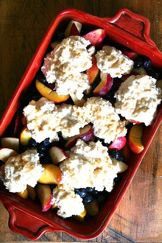This peach blueberry cobbler is perfect for summer parties. With vanilla ice cream melting through each bite, smiles will abound. If you're needing to make a dessert for a crowd, look no further. This is it. Yum yum yum yum yum. // alexandracooks.com