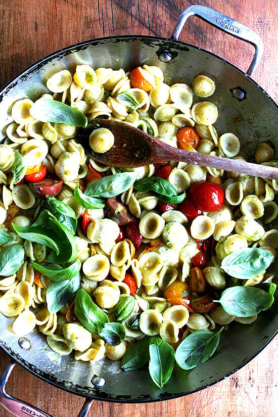 This summer pasta dish simple to prepare: Sauté cherry tomatoes with orecchiette, ciliegene mozzarella and basil pesto. Add some fresh basil just before plating along with some shavings of Parmigiano Reggiano and fresh cracked pepper. Yum yum yum. // alexandracooks.com