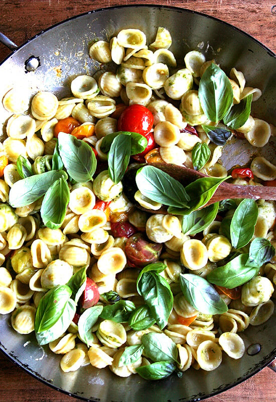 This summer pasta dish simple to prepare: Sauté cherry tomatoes with orecchiette, ciliegene mozzarella and basil pesto. Add some fresh basil just before plating along with some shavings of Parmigiano Reggiano and fresh cracked pepper. Yum yum yum. // alexandracooks.com