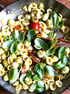 This summer pasta dish simple to prepare: Sauté cherry tomatoes with orecchiette, ciliegene mozzarella and basil pesto. Add some fresh basil just before plating along with some shavings of Parmigiano Reggiano and fresh cracked pepper. Yum yum yum. // alexandracooks.com