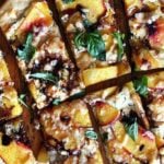 Just-baked nectarine pizza sliced into pieces.