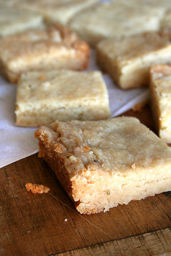 Just-baked rosemary shortbread cut into squares. 