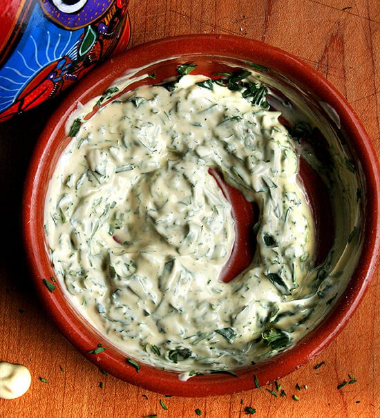 A bowl with tarragon mustard mayonnaise stirred together.
