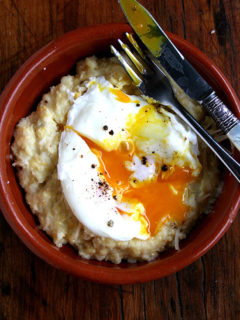 A plate of fresh corn polenta topped with a poached egg.