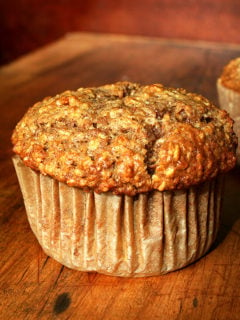An oatmeal muffin on a board.