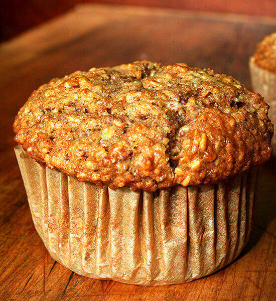 An oatmeal muffin on a board.