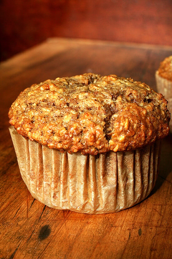 An oatmeal muffin on a board. 