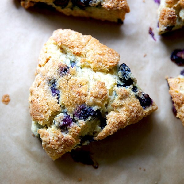 A blueberry scone on a sheet pan.