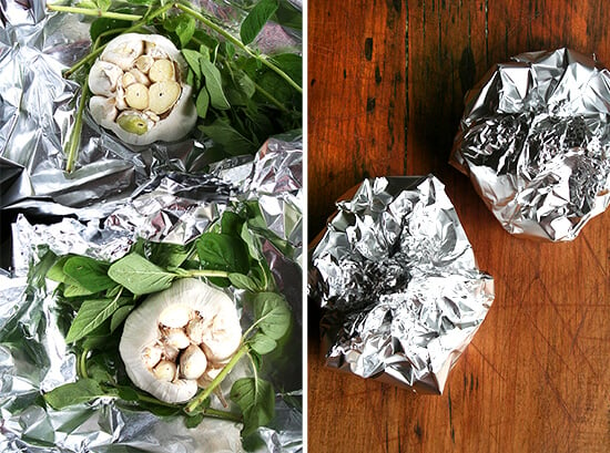 Foil Pouches filled with garlic heads and fresh oregano.