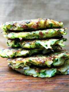 A combination of grated zucchini and potato with a little diced onion give these zucchini fritters a lovely latke texture. But the addition of lemon zest and lots of herbs give them a freshness and lightness that's irresistible. // alexandracooks.com