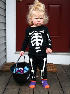 Ella, a one-year old, dressed in skeleton pjs.