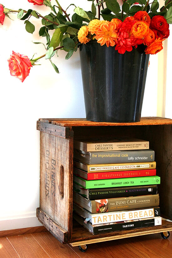 Looking for a purpose for old farm crates collecting dust in your basement? Try this farm crate bookshelf tutorial. It's not rocket science, will free up space in your home, and looks amazing! // alexandracooks.com