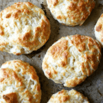 Tender and flaky, these buttermilk cheddar biscuits are the perfect vessel for housing slices of ham or turkey or roast beef, handfuls of arugula, and a slathering of mustard sauce, a must-have recipe if you're making ham this holiday season. // alexandracooks.com