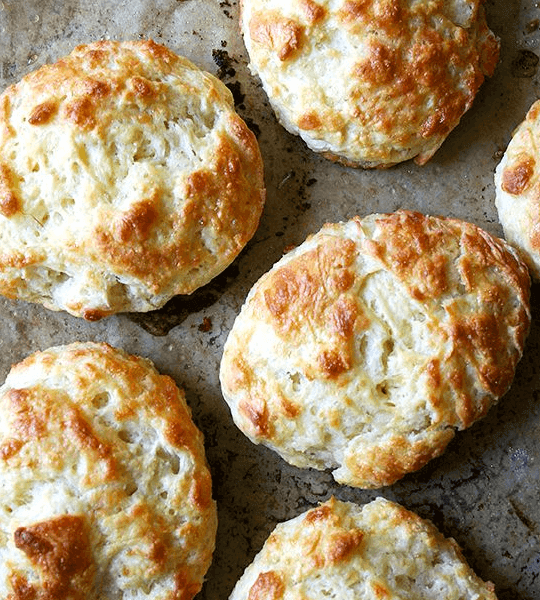Tender and flaky, these buttermilk cheddar biscuits are the perfect vessel for housing slices of ham or turkey or roast beef, handfuls of arugula, and a slathering of mustard sauce, a must-have recipe if you're making ham this holiday season. // alexandracooks.com