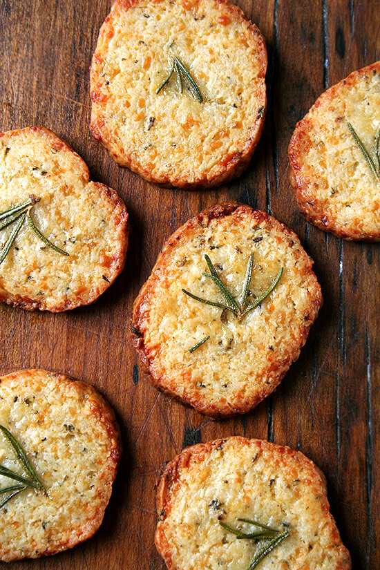 These salty parmesan rosemary crackers beg to be washed down with a heartwarming libation, one made with red wine and port, a little something called glogg. Glogg is potent stuff — bone-warming, rosy-cheek inducing, party-starting stuff. It's a beautiful thing. Happy New Year everyone! // alexandracooks.com