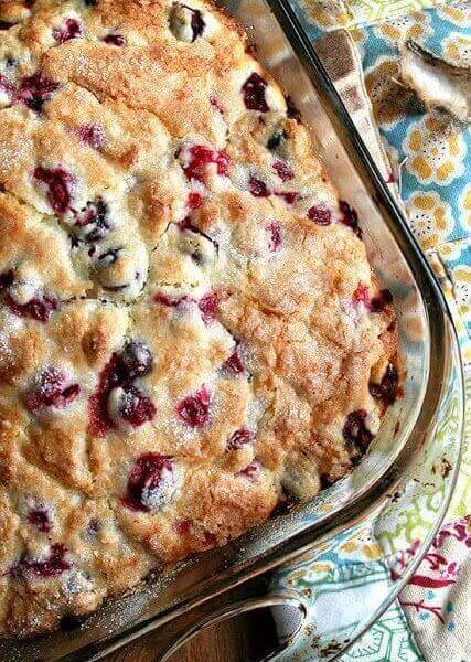 An overhead shot of a just-baked cranberry and orange buttermilk breakfast cake.