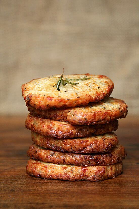 These salty parmesan rosemary crackers beg to be washed down with a heartwarming libation, one made with red wine and port, a little something called glogg. Glogg is potent stuff — bone-warming, rosy-cheek inducing, party-starting stuff. It's a beautiful thing. Happy New Year everyone! // alexandracooks.com