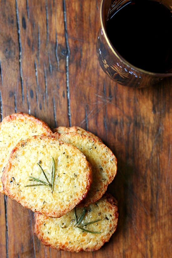 These salty parmesan rosemary crackers beg to be washed down with a heartwarming libation, one made with red wine and port, a little something called glogg. Glogg is potent stuff — bone-warming, rosy-cheek inducing, party-starting stuff. It's a beautiful thing. Happy New Year everyone! // alexandracooks.com