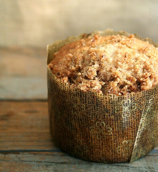 A coffeecake muffin on a table.