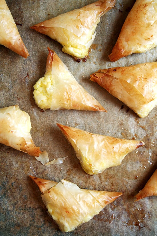 A sheet pan with just-baked tiropitas.