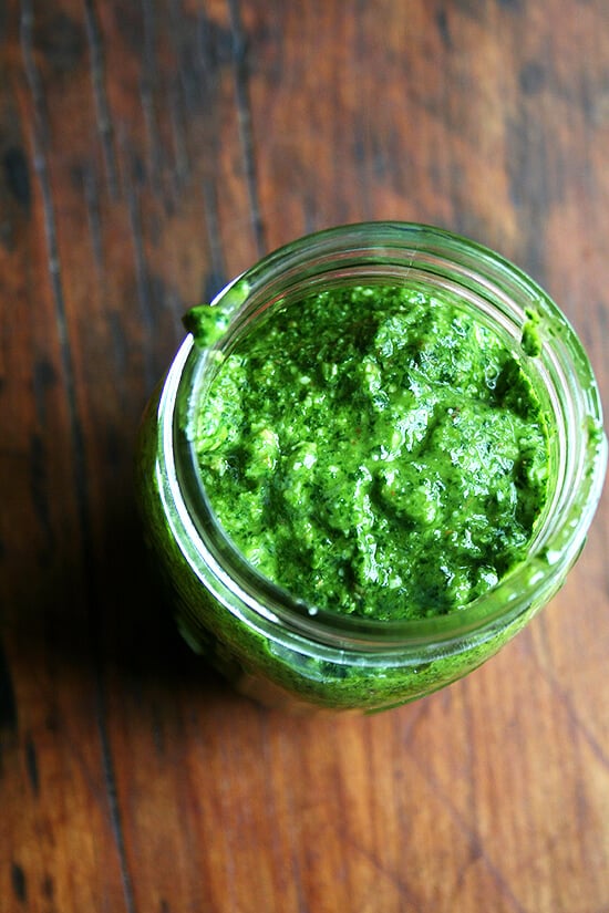 A jar of homemade pesto sauce. 