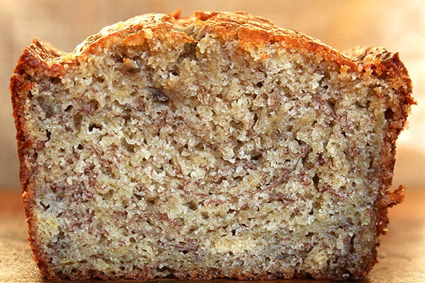 Cross-section of moist banana bread loaf. 