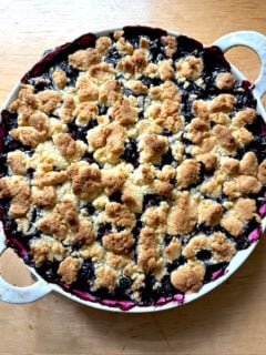 A gratin dish filled with Lemon-Blueberry Crisp.