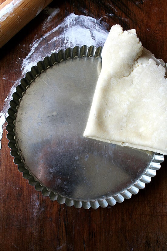 laying dough into tart pan