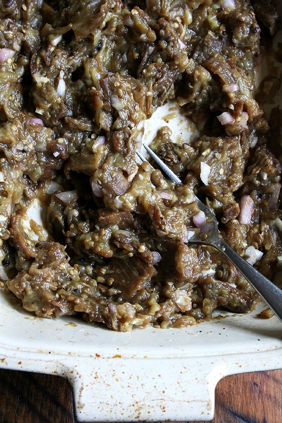 mashing the roasted eggplant