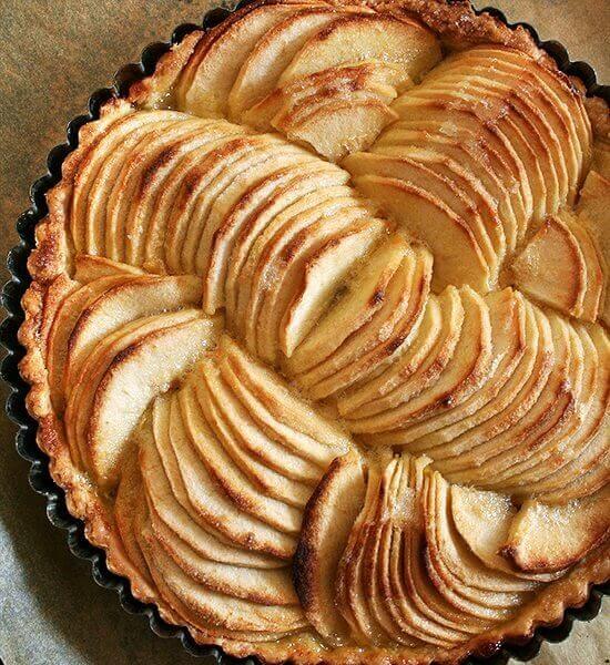 French apple tart in tart pan.