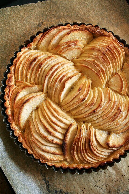 Just baked French apple tart in a tart pan. 